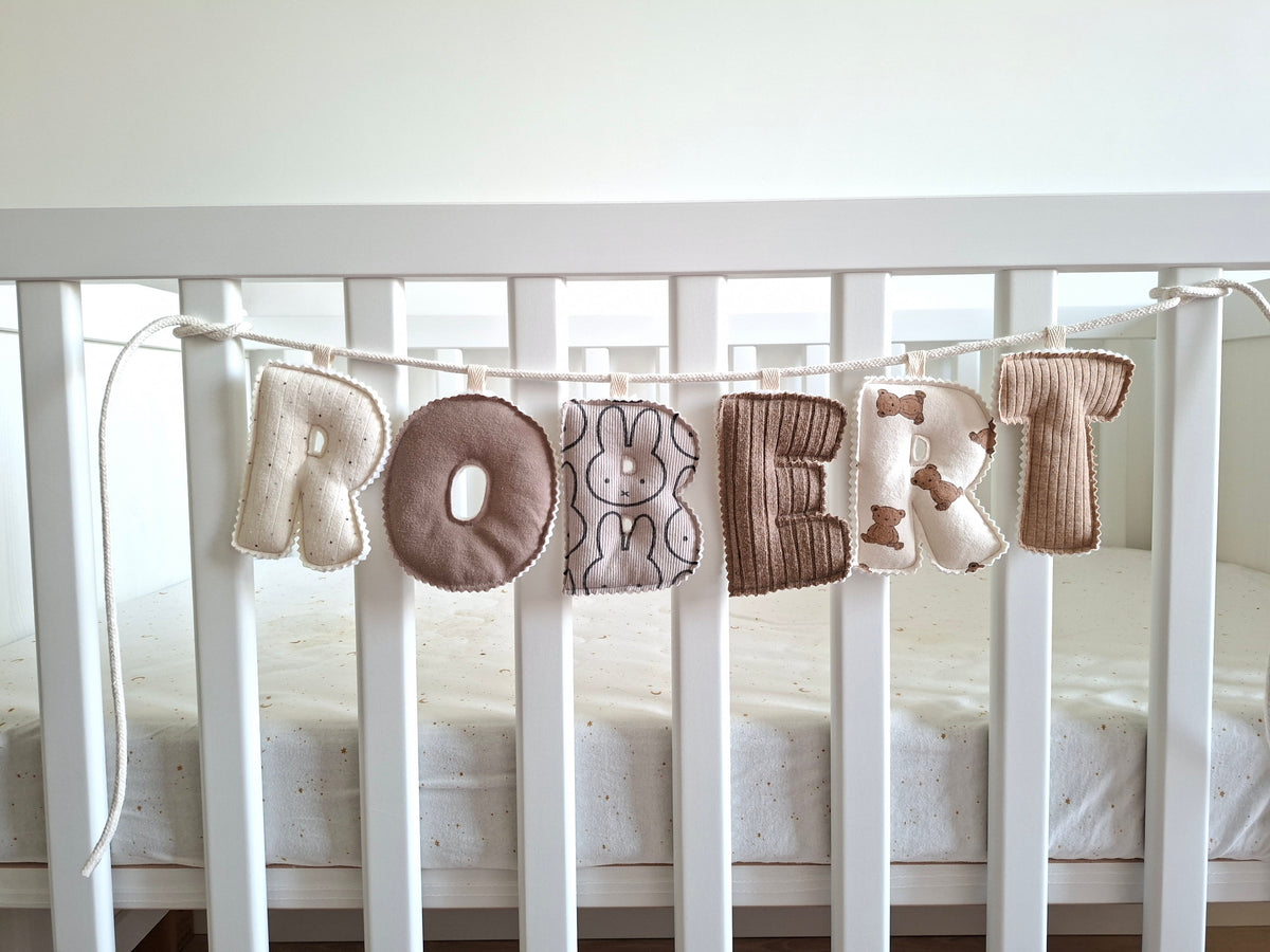 Naamslinger van babykleding